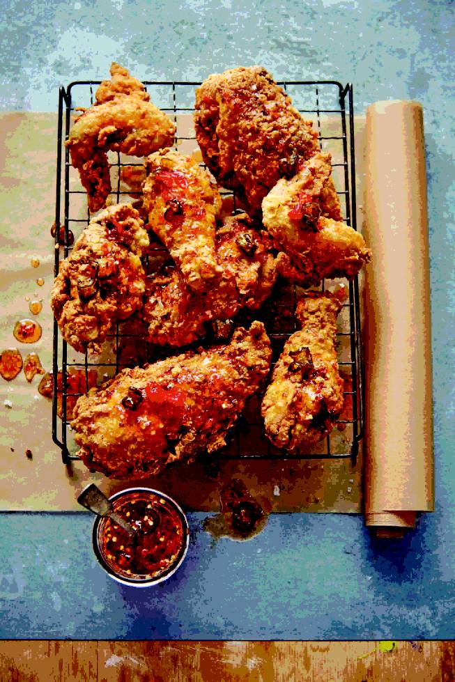 Spicy buttermilk fried chicken with pepper jelly drizzle by Emeril Lagasse.