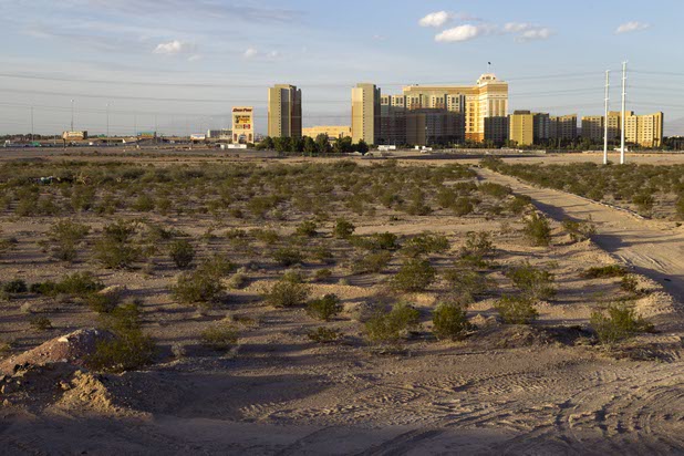 A view of vacant land is shown south of the South Point and a time-share complex in Henderson Monday, Nov. 2, 2015. About 56 acres of the land is being offered for sale by Station Casinos. 