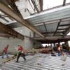 Construction workers on the 46th floor of the Wilshire Grand Center, the first new office tower built in Los Angeles in some 25 years. Backers hope the $1.2 billion mixed-use project will catalyze interest in the city’s revitalized downtown. 