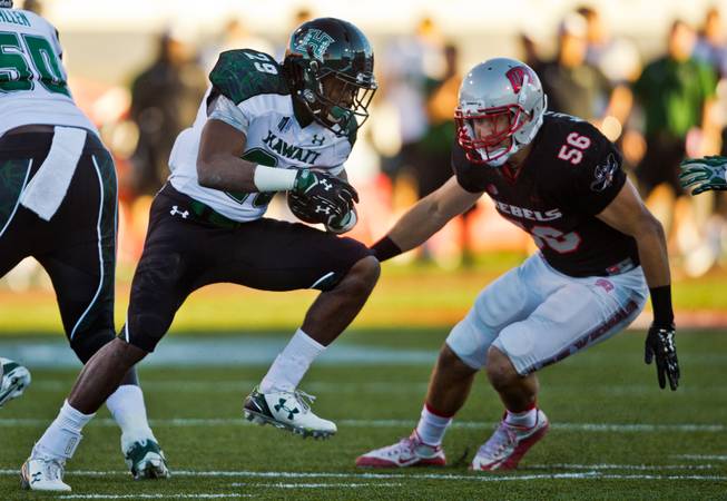 Hawaii's Paul Harris (29) readies to take a shot from UNLV's Ryan McAleenan (56) who cuts him off at the corner during their game at Sam Boyd Stadium on Saturday, November 7, 2015.