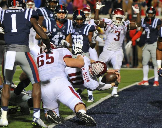 Arkansas quarterback Brandon Allen (10) dives into the end zone for a 2-point conversion during overtime against Mississippi on Saturday, Nov. 7, 2015, in Oxford, Miss. Arkansas won 53-52 in overtime.