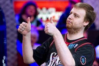 Joe McKeehen of Philadelphia gives a double thumbs up before the start of play during the World Series of Poker Main Event final table at the Rio Tuesday, Nov. 10, 2015.