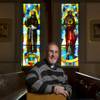 Father Max Oliva is a priest who has written a book on the moral and ethical practices people should use when engaging in business transactions. The author of 7 books lives near the St. Christopher Catholic Church and is a fan of the stained glass in its chapel.   