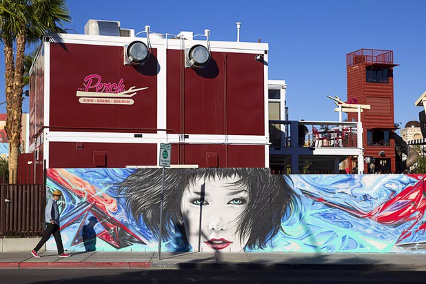 A man walks by the back wall of the Las Vegas Container Park in downtown Las Vegas Sunday, Nov. 1, 2015.