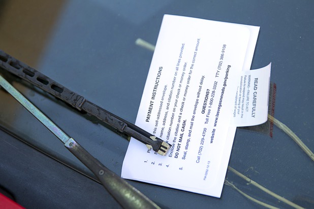 A car is shown with a parking ticket in downtown Las Vegas Wednesday, Nov. 4, 2015.