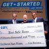 Executives from Cox Business present Text Safe Teens CEO Leon Wilde, middle, with a prize check after the company won a pitch contest in October.