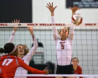 UNLV volleyball player Sadie Stutzman (5) blocks the ball back over the net versus New Mexico during their game at the Cox Pavilion on Thursday, November 12, 2015.