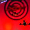 Drones fly under an obstacle during the inaugural Xtreme Drone Circuit in the Western Hotel in downtown Las Vegas Sunday, Nov. 15, 2015. The video-piloting sport has pilots tracking their drones through goggles that enable them to see the race from the drone's point-of view in real time.