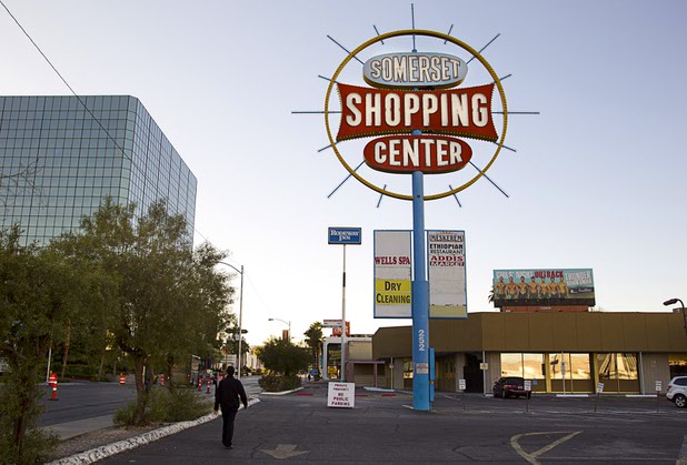 A pedestrian passes by the Somerset Shopping Center Monday, Nov. 23, 2015.