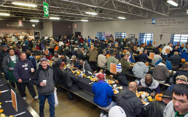 The dining room is filling up as Catholic Charities of Southern Nevada serves a traditional Thanksgiving dinner to homeless and vulnerable men, women and children on Thanksgiving Day on Thursday, November 26, 2015.
