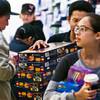 A Lego store employee at the Fashion Show mall brings out more products on a busy Black Friday in 2015.
