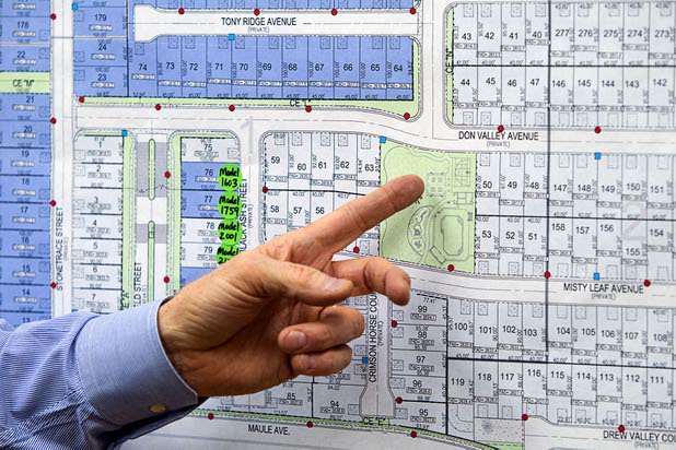 Don Boettcher, president for Century Communities' Nevada Division, points to a park in a residential development map during an interview at the company's offices Monday, Nov. 30, 2015.
