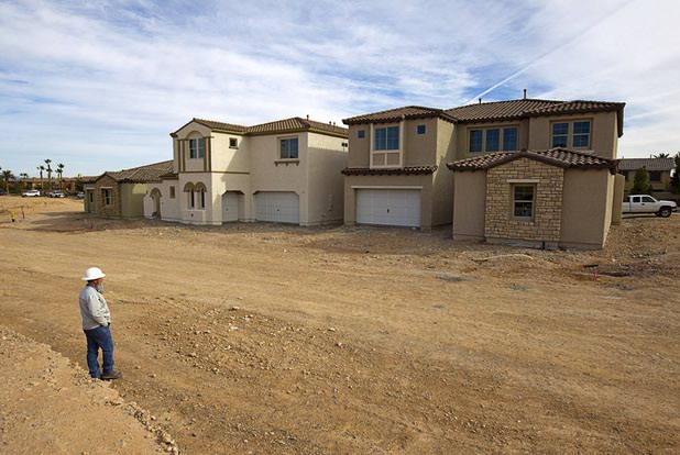 Model homes are shown under construction at The Estates at Rhodes Ranch, a Century Communities development, Thursday, Dec. 3, 2015. Project manager Dale Juilfs is at left.