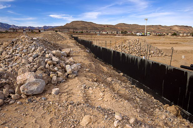 A wall is shown under construction at The Estates at Rhodes Ranch, a Century Communities development, Thursday, Dec. 3, 2015.