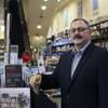 Ron Boire, chief executive of Barnes & Noble, stands in a Barnes & Noble on Dec. 2, 2015, in New York. Boire has recently been under pressure to reverse the fortunes of the beleaguered bookstore chain, which has been stung in recent years by the rise of Amazon, steep losses from its Nook e-reader division and a string of store closings. 