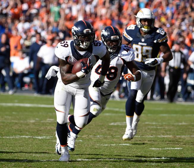 Denver Broncos inside linebacker Danny Trevathan scores on a interception against the San Diego Chargers during the first half Sunday, Dec. 6, 2015, in San Diego.