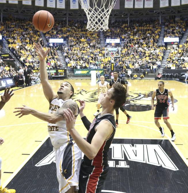 Wichita State guard Fred VanVleet shoots against UNLV forward Stephen Zimmerman Jr. during the first half of an NCAA college basketball game on Wednesday, Dec. 9, 2015, in Wichita, Kan. 