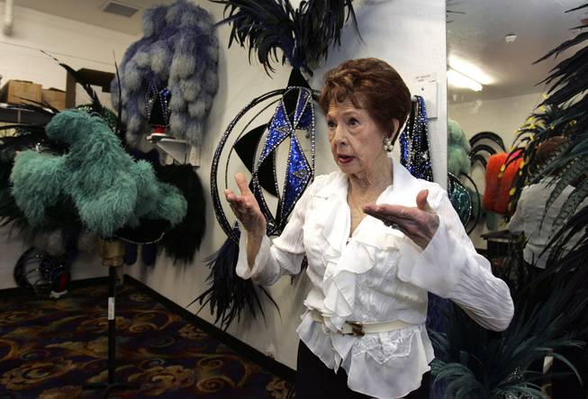Fluff LeCoque, company manager of "Jubilee!," talks about costumes in the Feather Room before a performance at Bally's in Las Vegas in July 2006. 