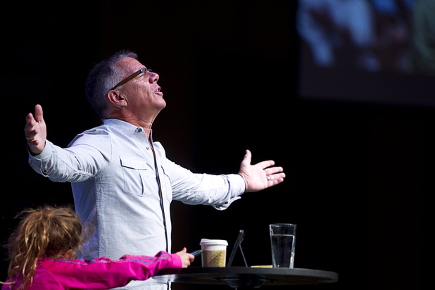 Pastor Paul Goulet delivers a sermon at the International Church of Las Vegas, 8100 Westcliff Drive, Sunday Dec. 13, 2015. Granddaughter Bravery Ana, 6, is at lower left.