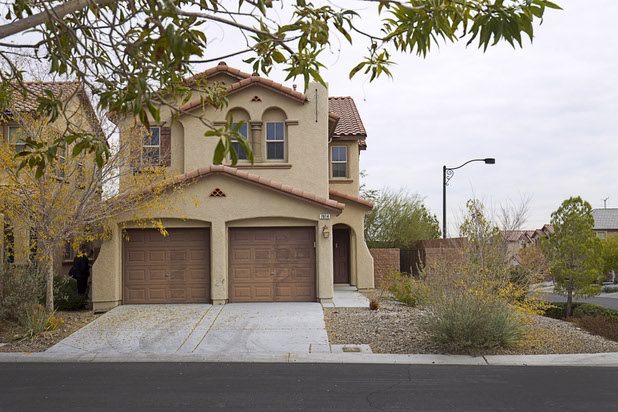 A home, previously occupied by squatters, is shown in northwest subdivision Dec. 9, 2015. A neighbor said she suspected something was wrong with the new residents when she didn't see any moving van or U-Haul truck arrive at the home.