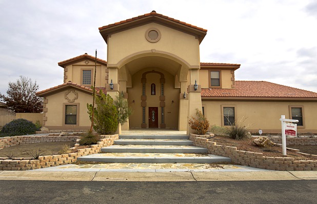 A high-end home is shown in the northwest part of the valley Dec. 9, 2015. The vacant home, now listed for sale, was be used by squatters police and neighbors say.