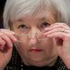 In this Feb. 25, 2015, file photo, Federal Reserve Chair Janet Yellen removes her glasses as she testifies on Capitol Hill in Washington.