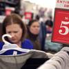 In this photo taken Saturday, Nov. 28, 2015, Janae Melvin shops for gifts at Old Navy in Kansas City, Kan.