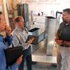 Scott Abbott, a retired Illinois State Police colonel, center, speaks with Mark Lewis, left, and Jeff Greer at the new medical marijuana dispensary being built in Collinsville, Ill. Abbott is the director of security and compliance with Health Central, Lewis is the director of finance and human resources for Health Central, and Greer is with LRS Network Support. The Associated Press has identified no fewer than 17 former law enforcement or legal officials involved in the state's new business, from one-time undercover narcotics officers to an ex-Secret Secret senior executive.
