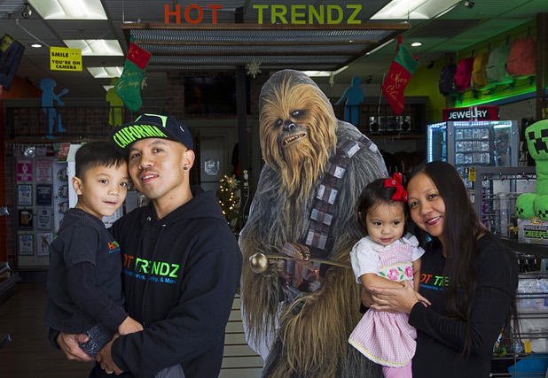 Alfredo Sibucao Jr. and his wife Misty pose with children Alden, 6, and Madily, 2, in Hot Trendz, 7500 W. Lake Mead Blvd., Monday, Dec. 28, 2015.