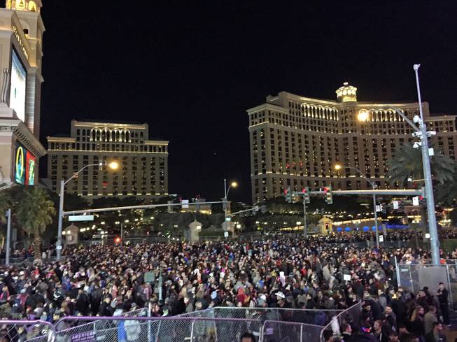 Crowds prepare for the big moment along the Strip for New Year's Eve in Las Vegas on Thursday, Dec. 31, 2015.