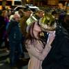 A couple shares a kiss on the Strip during New Year's Eve in Las Vegas on Thursday, December 31, 2015.