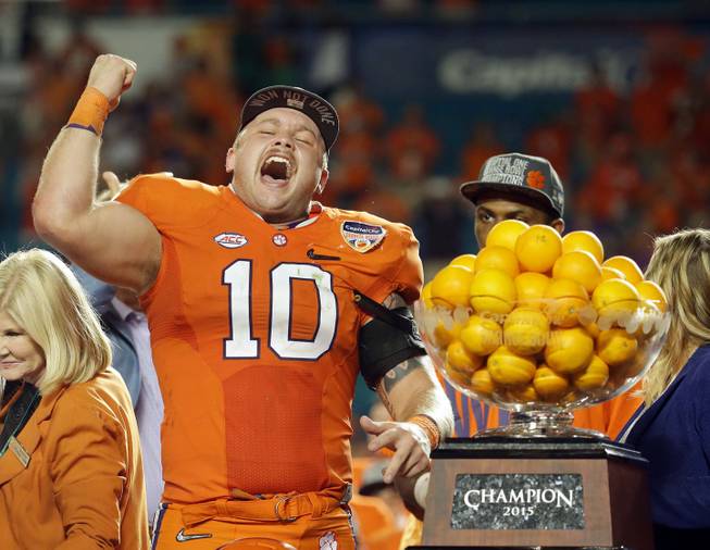 Clemson linebacker Ben Boulware (10) cheers during the award presentation after his team won the Orange Bowl NCAA college football semifinal playoff game against Oklahoma, Thursday, Dec. 31, 2015, in Miami Gardens, Fla. Clemson defeated Oklahoma 37-17. 