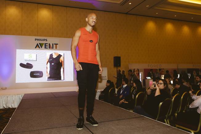 A model walks down the runway at a FashionWare show during CES at the Venetian on Jan. 7, 2016.  He is wearing items by Sensoria, a bio-sensing platform which includes an integrated suite of heart rate monitoring t-shirts and pressure sensitive smart socks