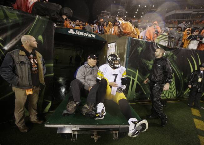 Pittsburgh Steelers' Ben Roethlisberger (7) is taken off the field after being injured during the second half of an NFL wild-card playoff football game against the Cincinnati Bengals Saturday, Jan. 9, 2016, in Cincinnati. 