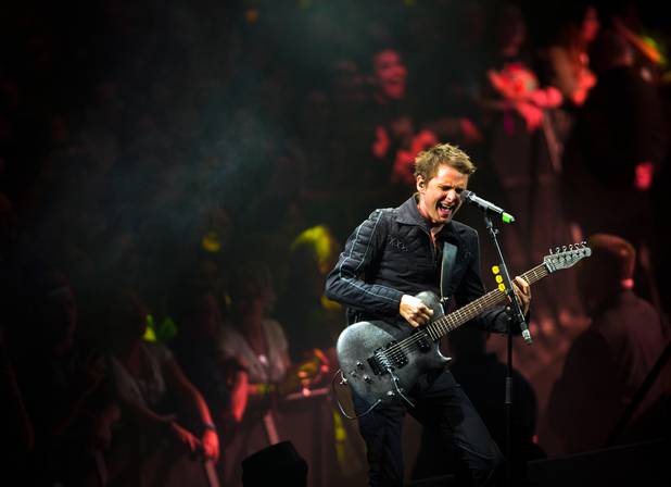 Muse frontman and guitarist Matt Bellamy performs Saturday, Jan. 9, ...