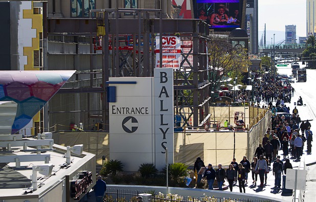 Pedestrians walk around a CVS pharmacy construction site on the Las Vegas Strip between Bally's and Paris Las Vegas Monday, Jan 11, 2016.
