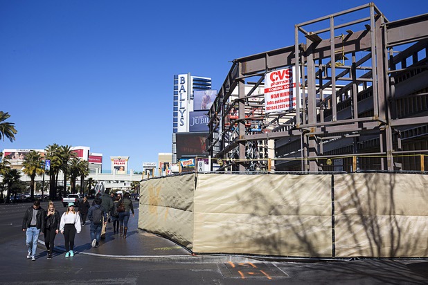 Pedestrians pass by a CVS pharmacy construction site on the Las Vegas Strip between Bally's and Paris Las Vegas Monday, Jan 11, 2016.
