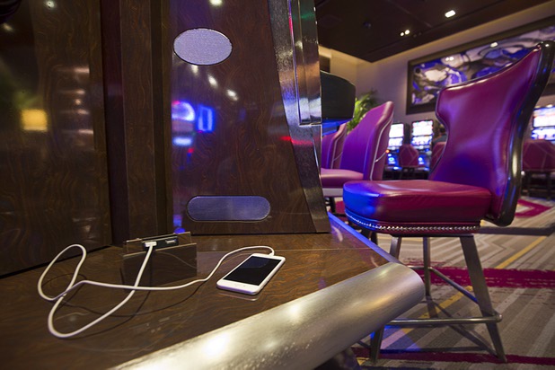 USB charging stations are shown between slot machines in the new high limit slot area at the Cosmopolitan Wednesday, Jan 13, 2016.
