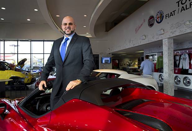 Josh "Chop" Towbin poses in a 2016 Alfa Romeo 4C Spider at Towbin Fiat Alfa Romeo, 2550 South Jones Blvd., Wednesday, Jan. 13, 2016.