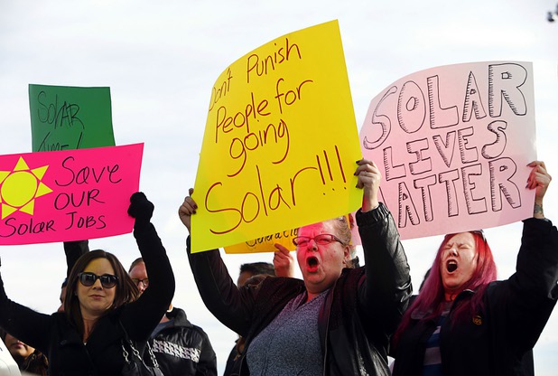 A poll released Wednesday, June 1, 2016, showed that Nevadans appeared to support development of renewable energy sources, with 66 percent of respondents indicating they had a favorable view of solar energy companies. In this file photo from Wednesday, Jan. 13, 2016, Tera Mills, center, and other solar supporters rally in front of Public Utilities Commission offices.