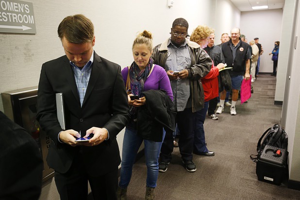 People line up to enter a Public Utilities Commission meeting Wednesday, Jan 13, 2016.