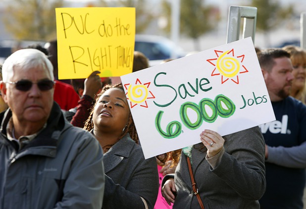 Solar supporters rally in front of Public Utilities Commission offices Wednesday, Jan 13, 2016.