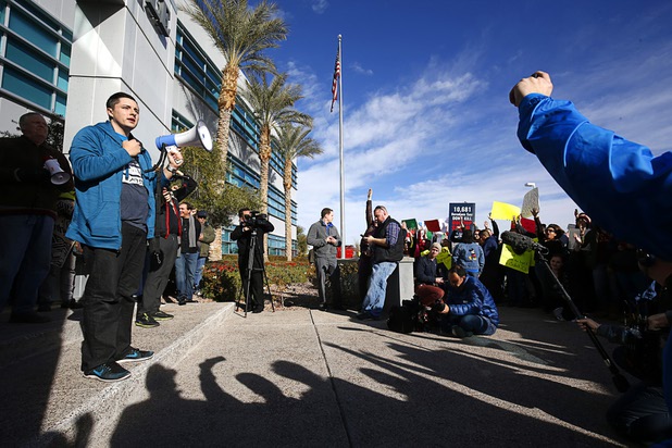 Justin Smith speaks to solar supporters during a rally in front of Public Utilities Commission offices Wednesday, Jan 13, 2016. Smith said he had lost his job as a district sales manager for Sunrun, a solar lease and installation company.