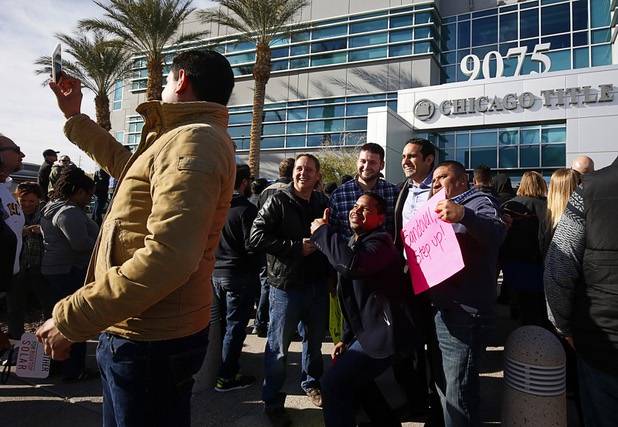 Solar supporters take a selfie during a rally in front of Public Utilities Commission offices Wednesday, Jan 13, 2016.