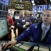 Specialist Robert Nelson works on the floor of the New York Stock Exchange on Wednesday, Jan. 13, 2016.