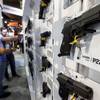 Guns are displayed at the Sig Sauer booth during the SHOT (Shooting, Hunting and Outdoor Trade) Show on Tuesday, Jan. 19, 2016, at Sands Expo.