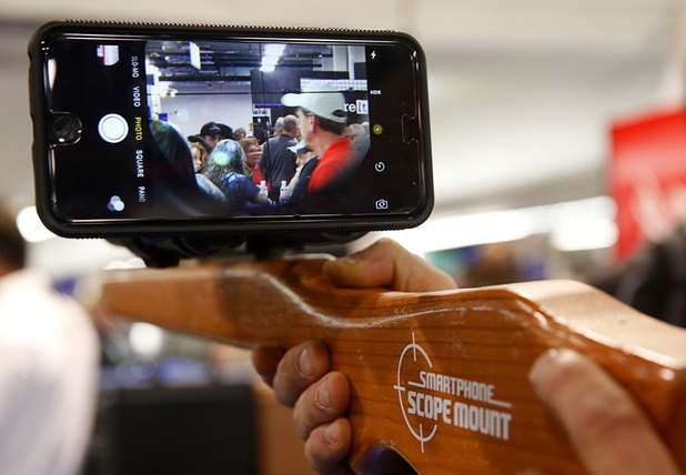A Smartphone Scope Mount is displayed during the SHOT (Shooting, Hunting and Outdoor Trade) Show at the Sands Expo Tuesday, Jan. 19, 2016. The mount allows allows the hunter to view through his scope on the phone and take video.