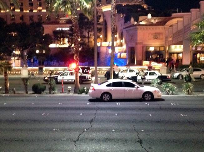 Metro Police officers block Las Vegas Boulevard South at Flamingo Road at the scene of an officer-involved shooting on Friday, Jan. 22, 2016. The boulevard was closed between Flamingo and the Paris resort as officers investigated.