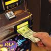 A $100 bill is fed into a slot machine. Slot machines accounted for 63 percent of the  $11.1 billion won by Nevada casinos in 2015, according to the Nevada Gaming Control Board.
