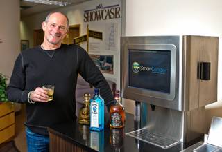 Real estate developer Barry Fieldman with his new venture, the automated cocktail maker called a Smartender, on Tuesday, Feb. 2, 2016.